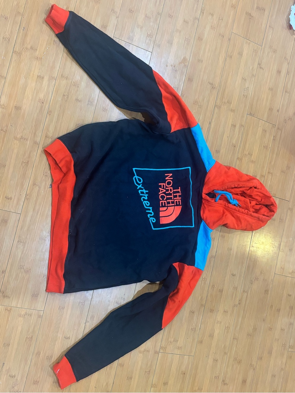 The North Face Black Hoodie with Red Hood & Blue Accents